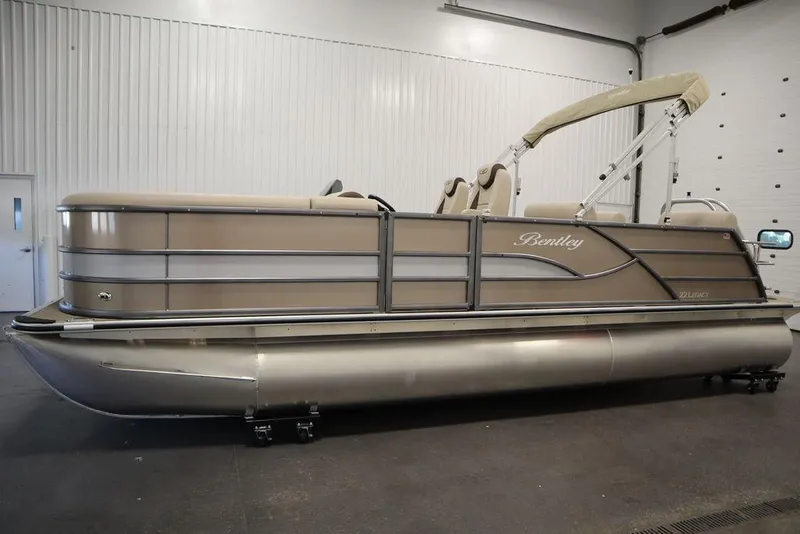 Slide: The Image of 2025 Bentley Pontoons 223 QSB Tri-Toon in a showroom setting. - 8