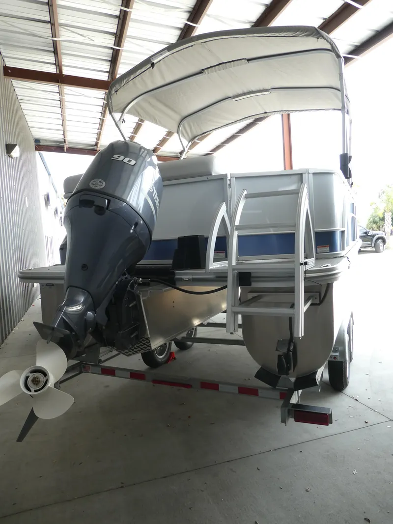 Slide: The Image of 2023 SunCatcher Select 20FC pontoon boat with outboard motor and canopy. - 3