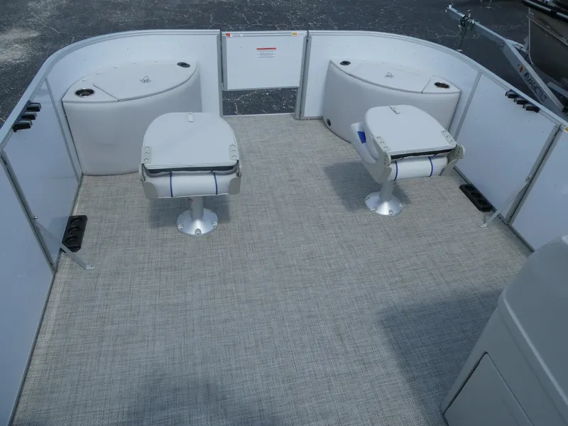 Slide: The Image of 2023 SunCatcher Select 20FC boat interior with two swivel seats and storage compartments. - 4
