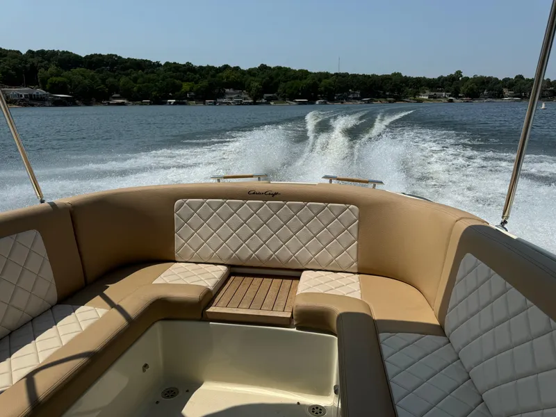 Slide: The Image of 2019 Chris-Craft Launch 27 cruising on a lake with elegant seating. - 11