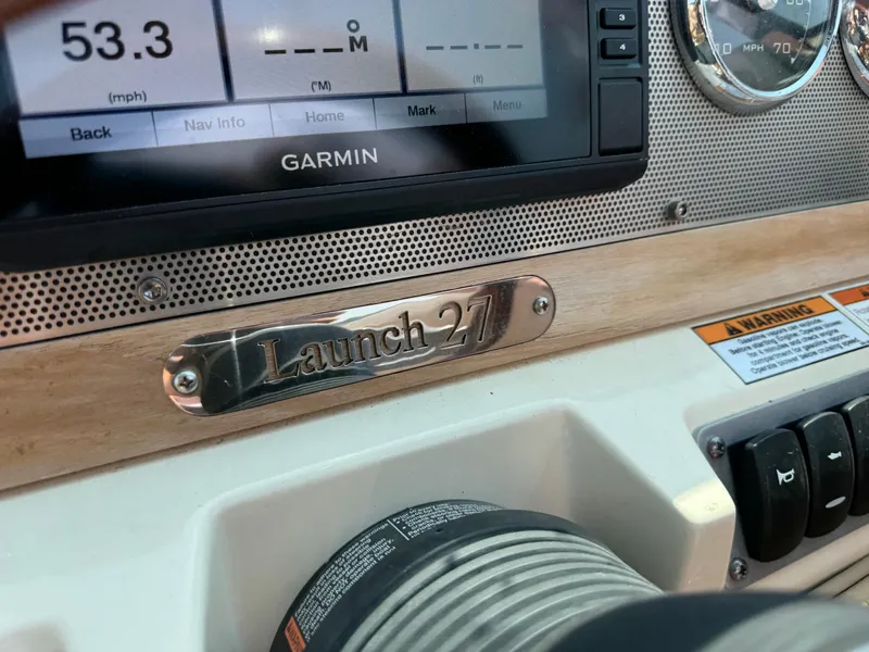 Slide: The Image of Dashboard of 2019 Chris-Craft Launch 27 with Garmin display and speedometer. - 12