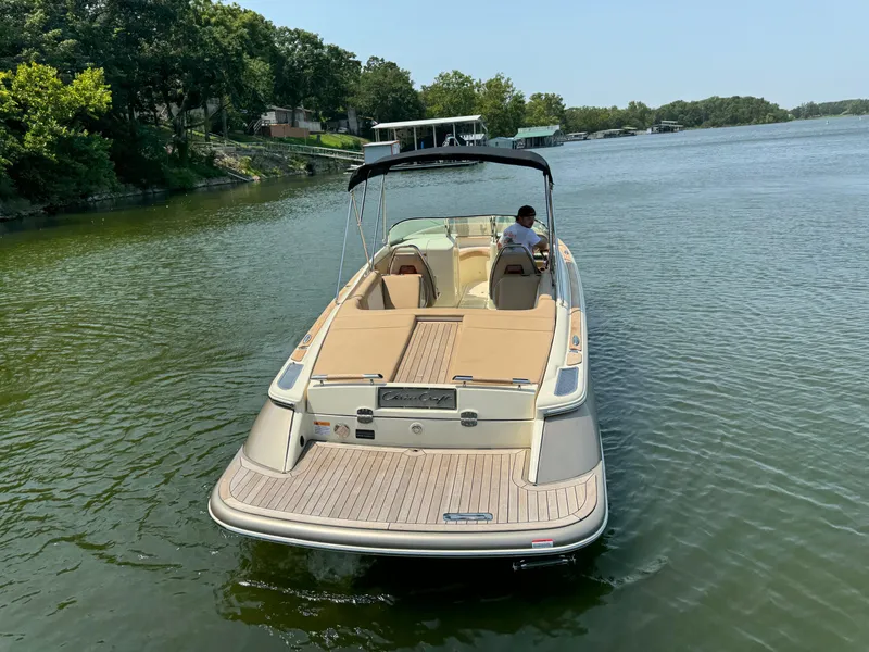 Slide: The Image of 2019 Chris-Craft Launch 27 boat on a serene lake. - 5