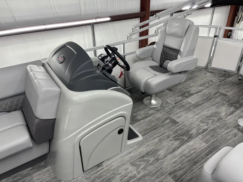 Slide: The Image of 2024 Ranger 220C boat interior with modern helm and plush seating. - 4