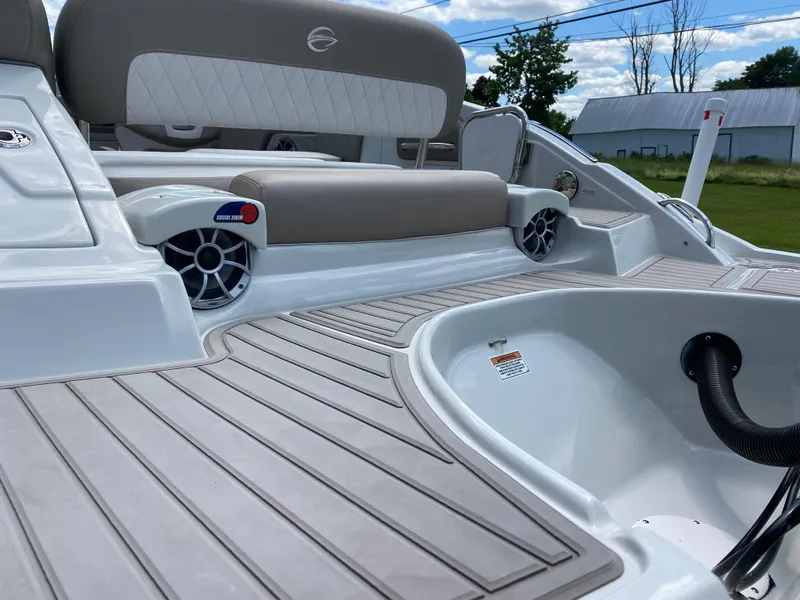 Slide: The Image of 2023 Crownline 280 XSS boat deck with seating and speakers, showcasing luxury and comfort. - 15