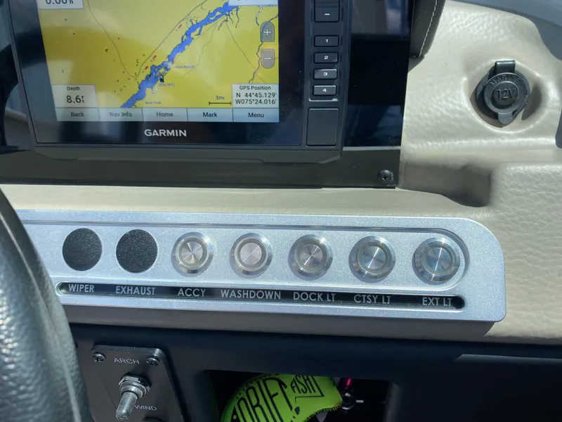 Slide: The Image of Dashboard of 2023 Crownline 280 XSS with Garmin GPS and control switches. - 19