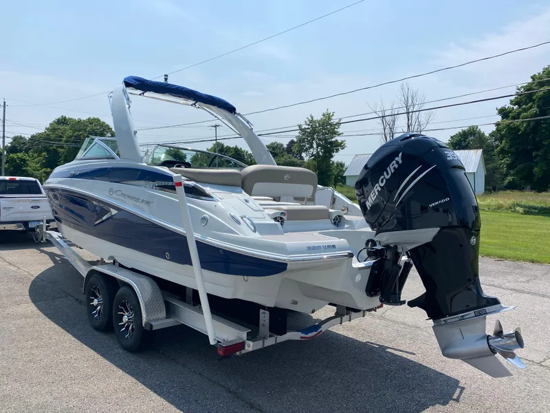 Slide: The Image of 2023 Crownline 280 XSS boat on trailer with Mercury outboard motor. - 2