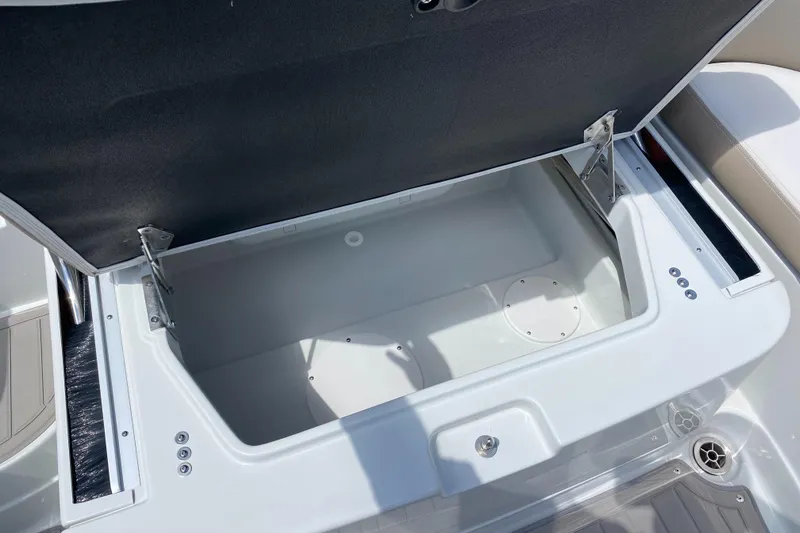 Slide: The Image of Open storage compartment on 2023 Crownline 280 XSS boat. - 30