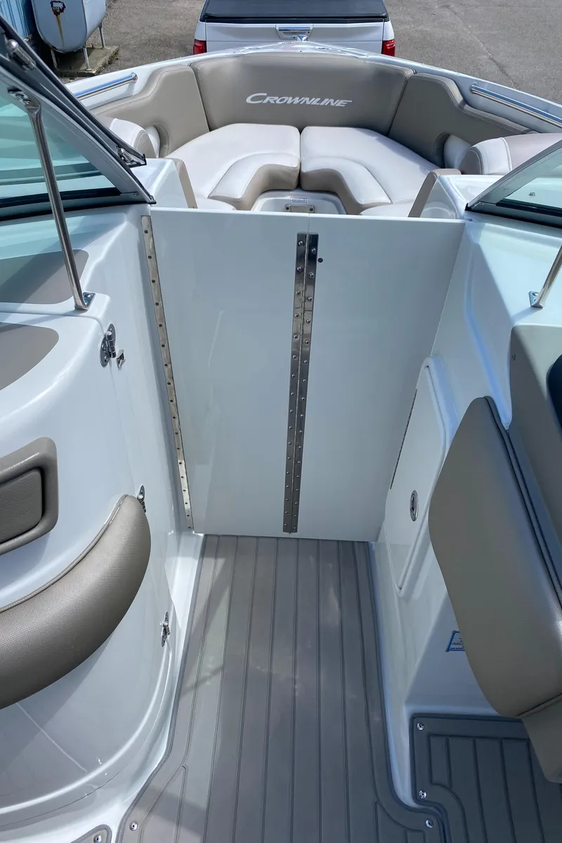 Slide: The Image of 2023 Crownline 280 XSS boat interior with cushioned seating and sleek design. - 39
