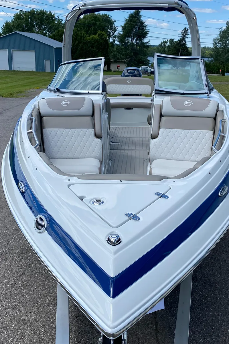 Slide: The Image of 2023 Crownline 280 XSS boat with open bow seating and sleek design. - 5