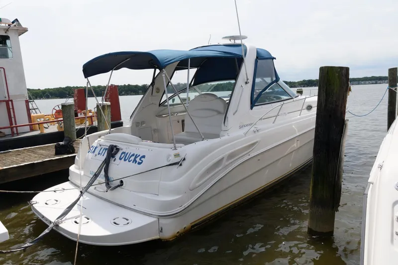 The Image of 1999 Sea Ray 340 Sundancer boat docked at a marina. - 0