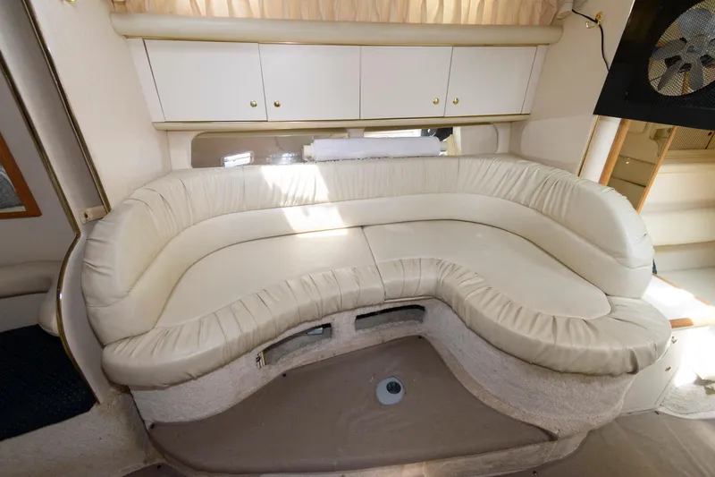 Slide: The Image of Interior seating area of a 1999 Sea Ray 340 Sundancer boat. - 11