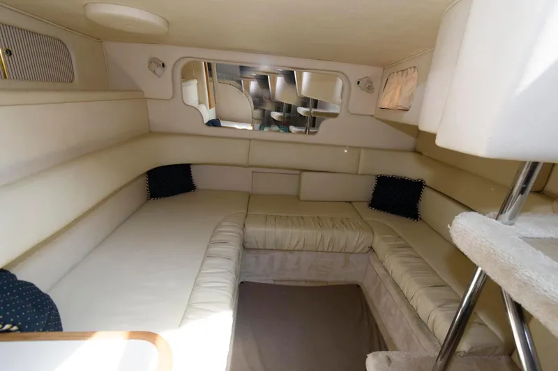 Slide: The Image of Interior cabin of 1999 Sea Ray 340 Sundancer yacht with beige seating. - 13