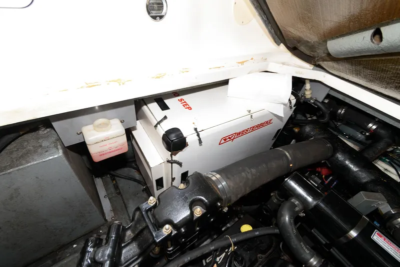 Slide: The Image of Engine compartment of a 1999 Sea Ray 340 Sundancer boat with Westerbeke generator. - 17