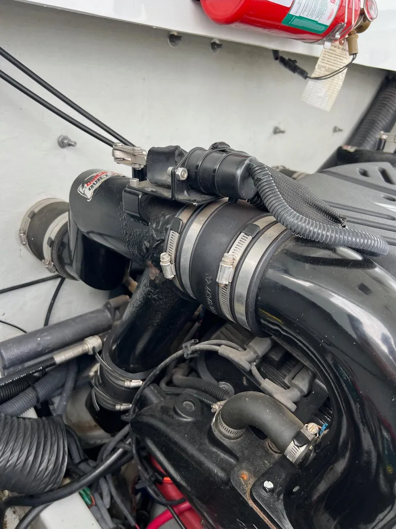 Slide: The Image of Close-up of the engine compartment of a 2007 Baja Outlaw 260 boat. - 11