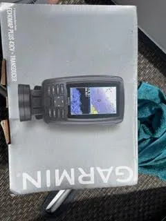 Slide: The Image of Garmin fishfinder box on a carpeted floor, 2017 Monterey 197 BR Blackfin. - 11