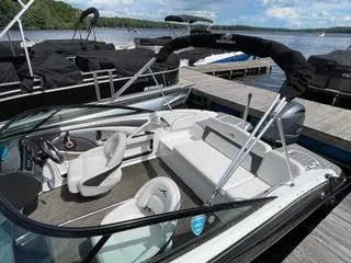 Slide: The Image of 2017 Monterey 197 BR Blackfin boat docked at a marina on a sunny day. - 13