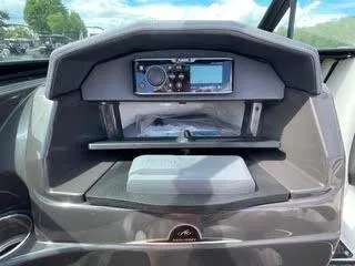 Slide: The Image of Dashboard of a 2017 Monterey 197 BR Blackfin boat with a marine radio. - 19