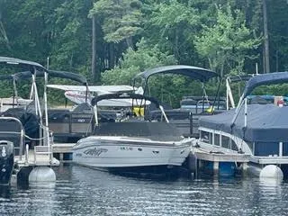 Slide: The Image of 2017 Monterey 197 BR Blackfin boat docked at a marina surrounded by other boats. - 2