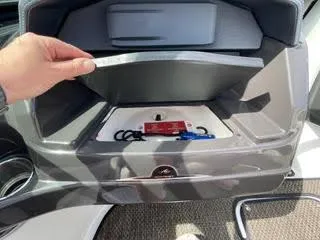 Slide: The Image of Hand opening storage compartment on 2017 Monterey 197 BR Blackfin boat. - 21