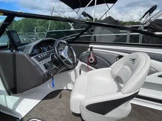 Slide: The Image of 2017 Monterey 197 BR Blackfin boat interior with steering wheel and captain's seat. - 22
