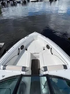 Slide: The Image of 2017 Monterey 197 BR Blackfin boat interior with white seating and water view. - 23