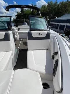Slide: The Image of 2017 Monterey 197 BR Blackfin boat interior with white seating and open windshield. - 24