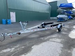 Slide: The Image of Boat trailer for 2017 Monterey 197 BR Blackfin, parked outside a green warehouse. - 36