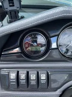 Slide: The Image of Dashboard controls and gauges of a 2017 Monterey 197 BR Blackfin boat. - 6