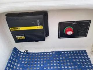 Slide: The Image of Battery charger and control panel in a 2017 Monterey 197 BR Blackfin boat. - 9