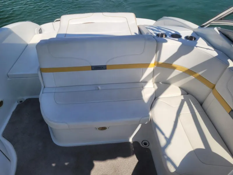 Slide: The Image of 2007 Formula 240 BR boat interior with white and yellow seating. - 10