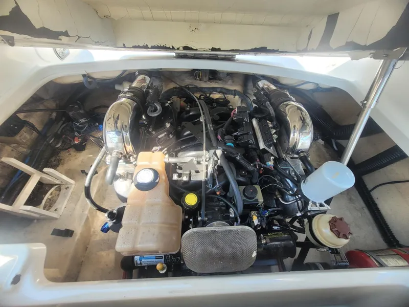 Slide: The Image of Engine compartment of a 2007 Formula 240 BR boat with visible components. - 12