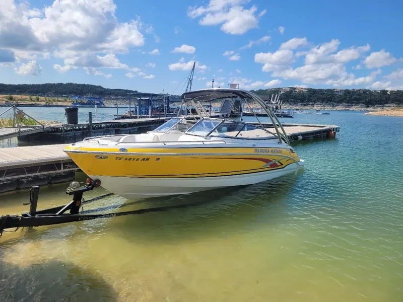 Slide: The Image of 2007 Formula 240 BR boat docked at a marina on a sunny day. - 13