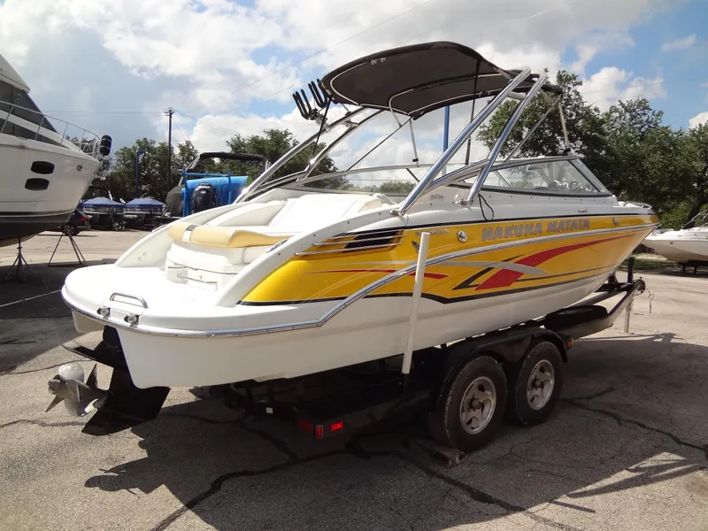 Slide: The Image of 2007 Formula 240 BR boat on a trailer, yellow and white design. - 22