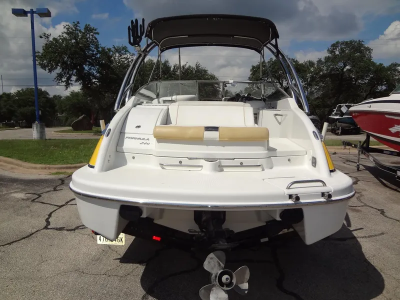 Slide: The Image of 2007 Formula 240 BR boat, rear view, parked on a trailer. - 23