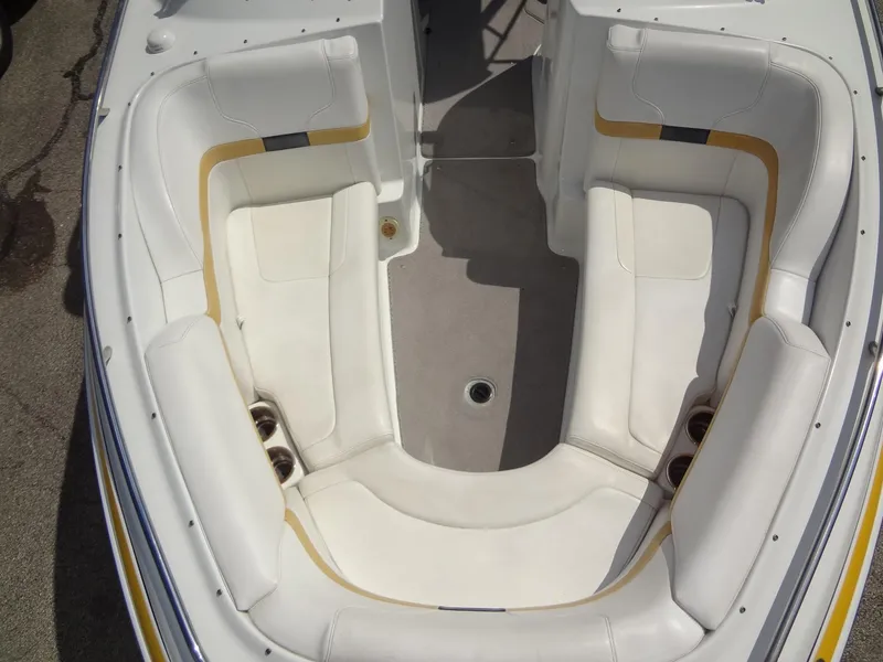 Slide: The Image of 2007 Formula 240 BR boat interior with white and yellow seating. - 28