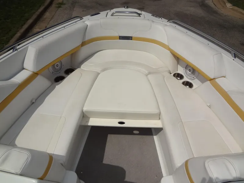 Slide: The Image of 2007 Formula 240 BR boat with white and yellow interior seating. - 29