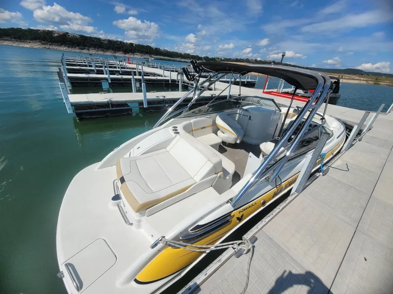 Slide: The Image of 2007 Formula 240 BR boat docked at a marina on a sunny day. - 3