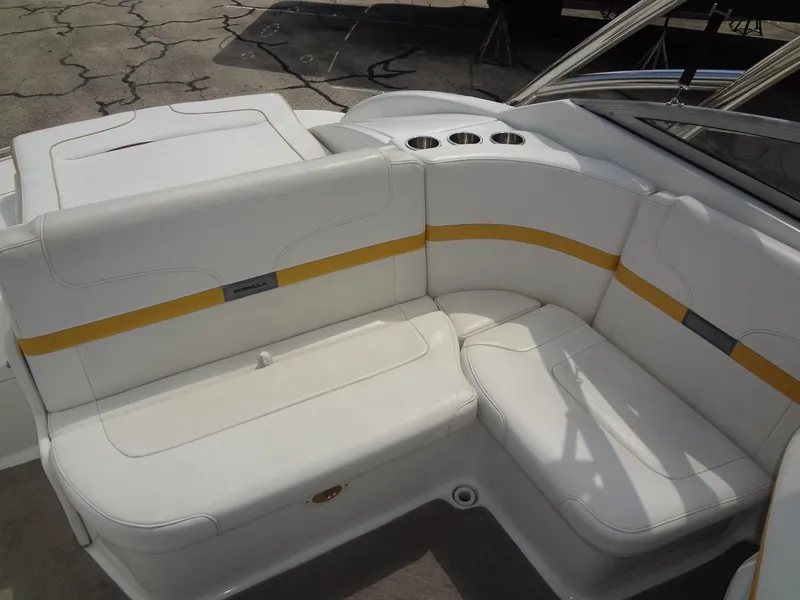 Slide: The Image of 2007 Formula 240 BR boat interior with white and yellow seating. - 32