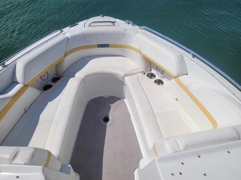 Slide: The Image of 2007 Formula 240 BR boat interior with white and yellow seating. - 4