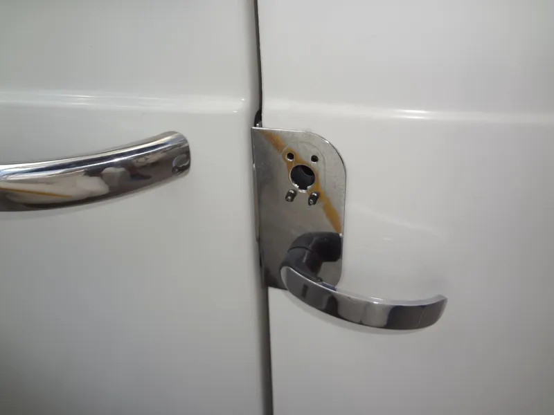 Slide: The Image of Close-up of a 2007 Formula 240 BR boat door handle. - 44
