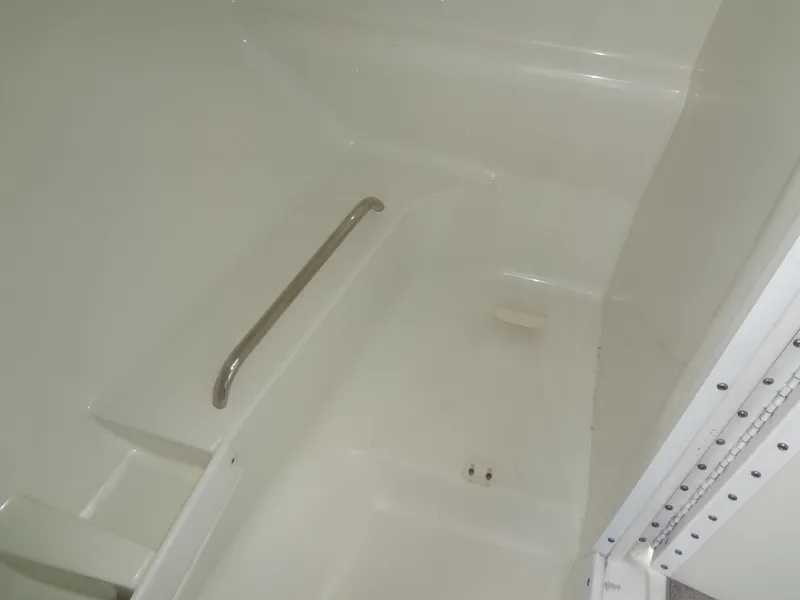 Slide: The Image of 2007 Formula 240 BR boat interior with white fiberglass finish and handrail. - 45