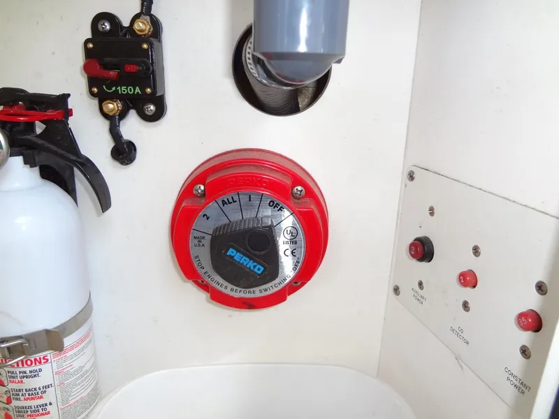 Slide: The Image of 2007 Formula 240 BR boat control panel with fire extinguisher and Perko battery switch. - 46