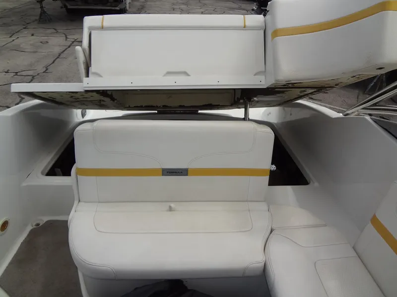 Slide: The Image of 2007 Formula 240 BR boat interior with white and yellow seating. - 47
