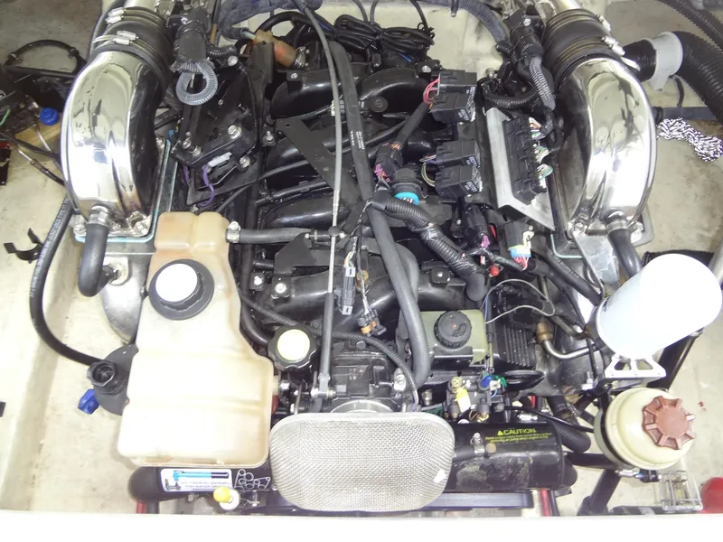 Slide: The Image of 2007 Formula 240 BR boat engine compartment with various components and wiring. - 48