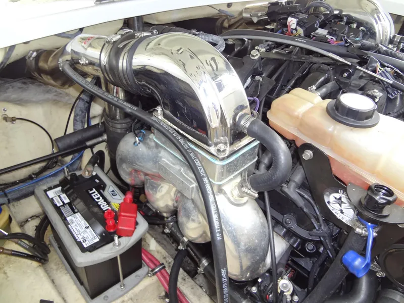 Slide: The Image of Engine compartment of a 2007 Formula 240 BR boat with battery and cooling system. - 49