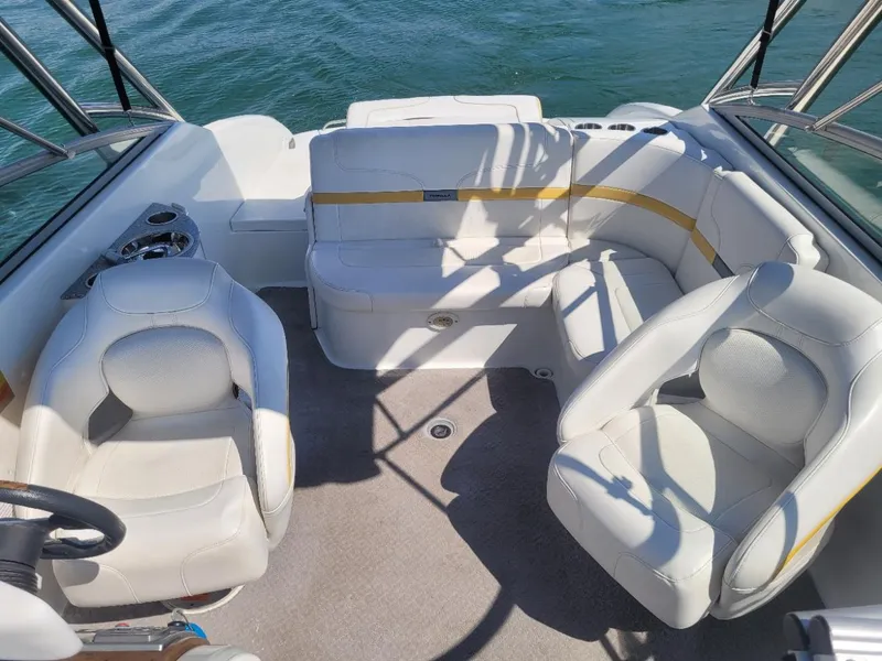 Slide: The Image of Interior of a 2007 Formula 240 BR boat with white seating and carpet. - 5