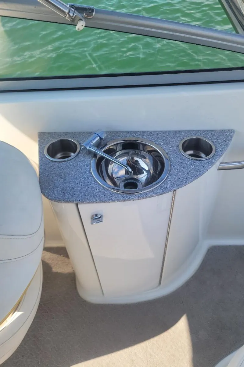 Slide: The Image of 2007 Formula 240 BR boat interior with sink and cup holders. - 8