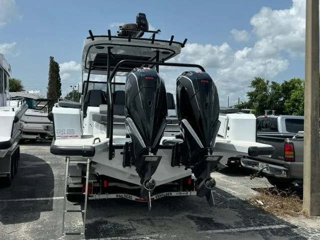 Slide: The Image of 2024 BRABUS Shadow 1000 ST boat with dual engines, parked outdoors. - 5