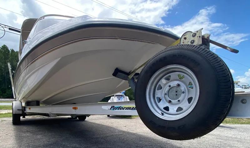 Slide: The Image of 1997 Chaparral 250 Sunseta boat on a trailer, viewed from the front. - 20