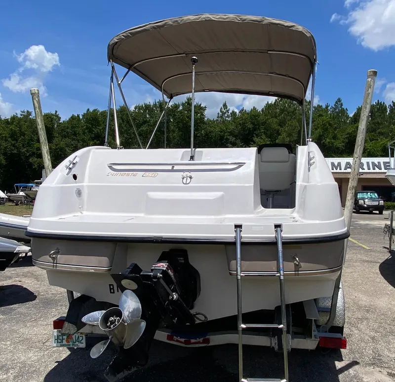 Slide: The Image of 1997 Chaparral 250 Sunseta boat with canopy and ladder, rear view. - 3